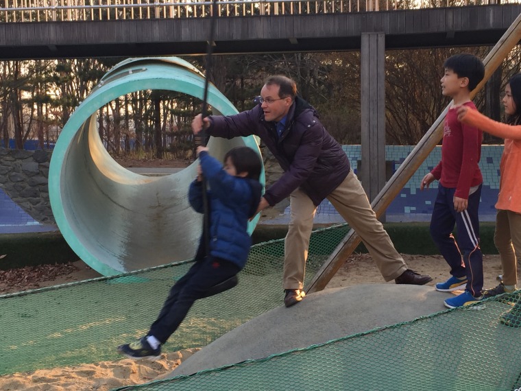 Image: Greg Brooks-English playing with his son