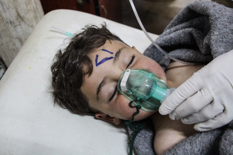Image: A Syrian child receives treatment after an alleged chemical attack