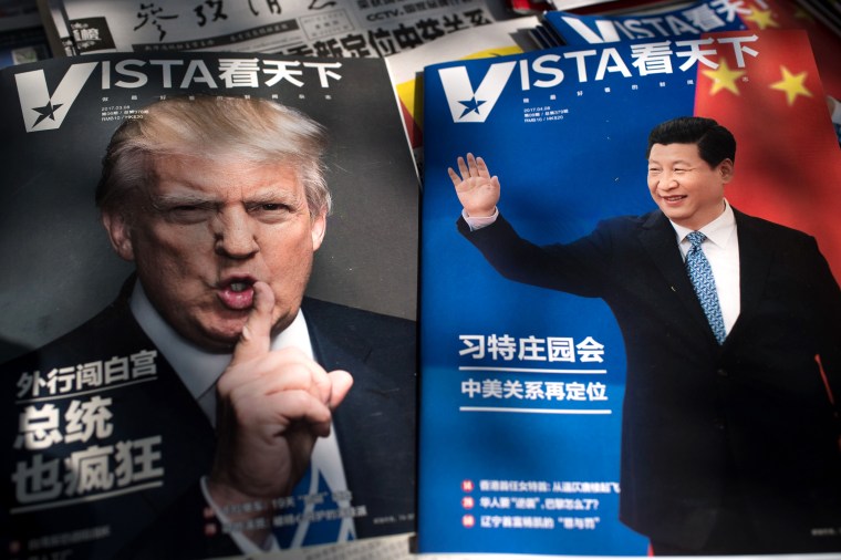 Image: Magazines featuring front pages of US President Donald Trump and China's President Xi Jinping