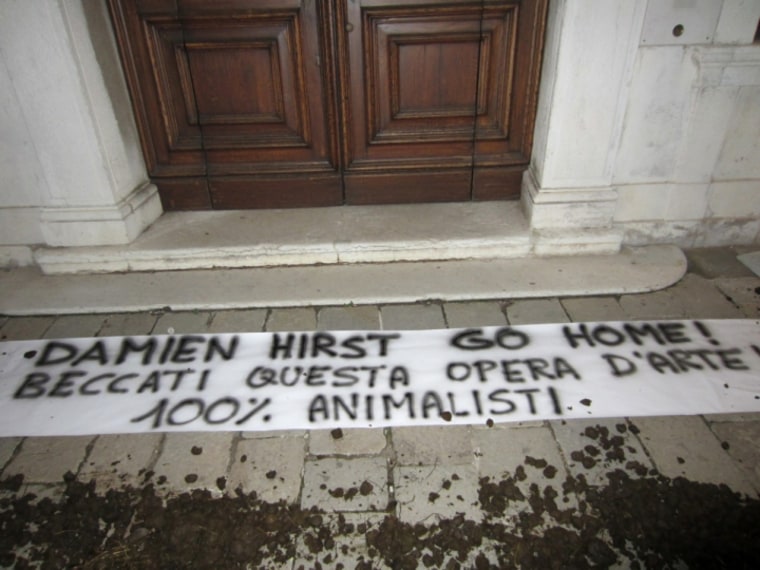 Image: Dung was placed outside the Palazzo Grassi in protest of Damien Hirst's latest exhibition