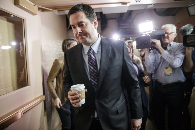Image: Devin Nunes is pursued by reporters as he arrives for a weekly meeting
