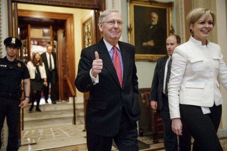 Image: Mitch McConnell signals a thumbs-up as he leaves the Senate chamber on Capitol Hill