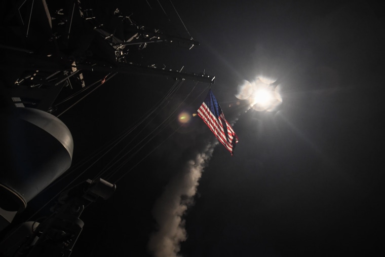 Image: The guided-missile destroyer USS Porter fires a Tomahawk land attack missile in the Mediterranean Sea