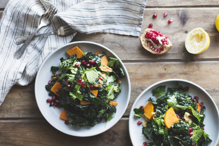 kale salad with herbs, pomegranate, persimmon