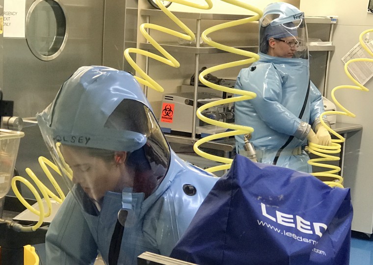 Image: Scientists at the University of Texas Medical Branch work in a specialized, high-security biological containment facility to develop therapies for dangerous pathogens like Marburg and Ravn viruses