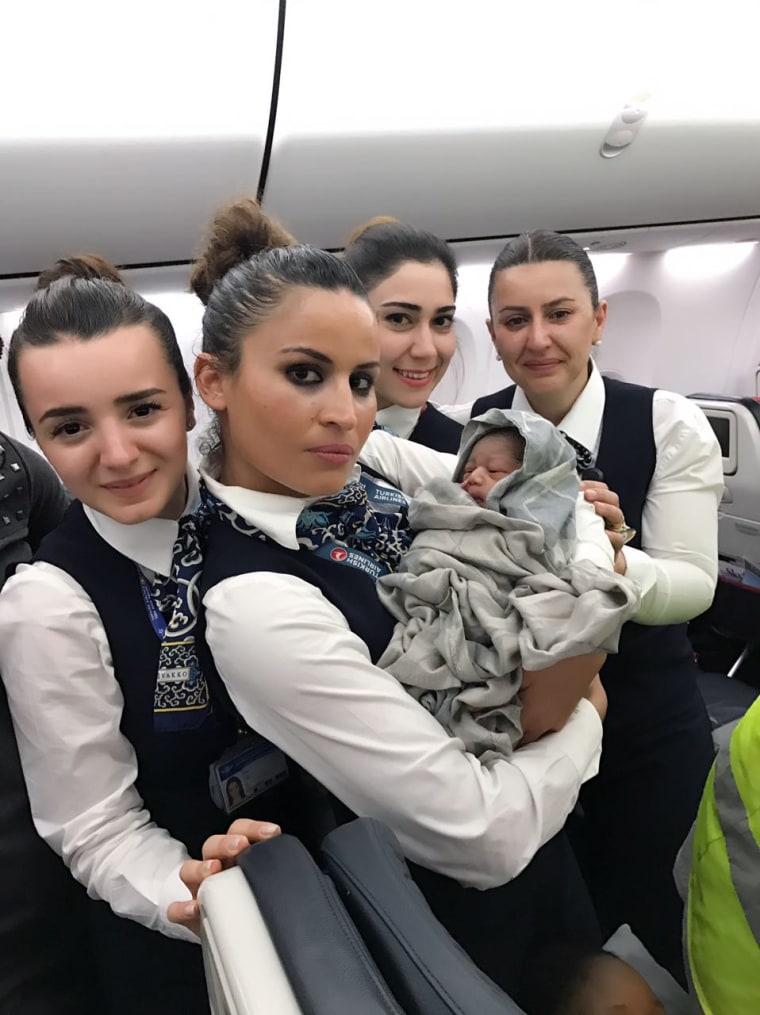 Image: Cabin crew and baby
