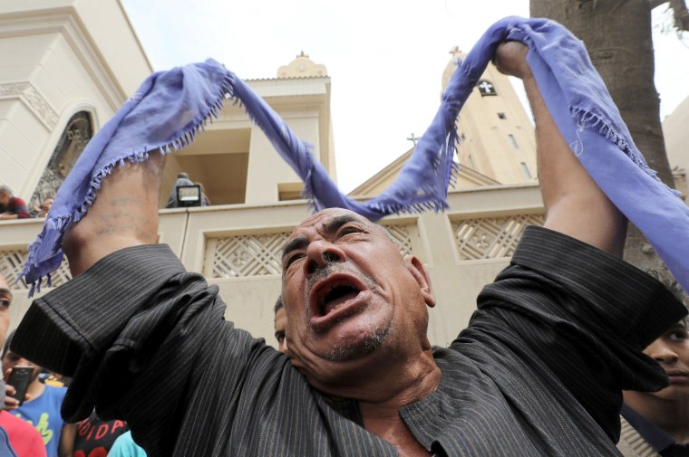 Image: A relative of one of the victims reacts after the explosion.