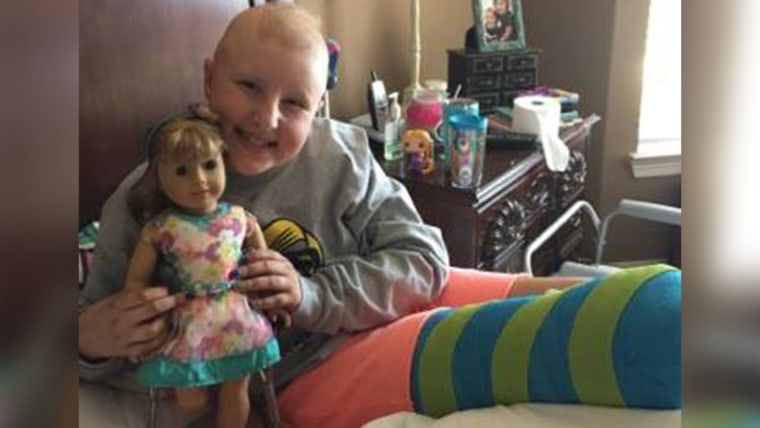 Dylan with her special American Girl doll, who has a prosthetic leg just like hers. 
