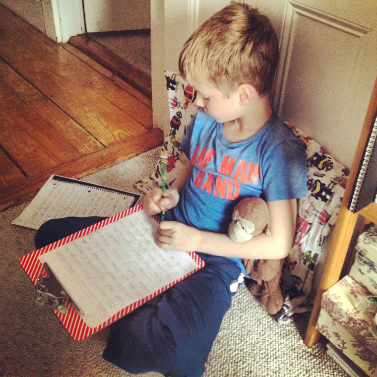 Lindsey Mead's son, Whit, sits quietly in a corner of her office while he does his own work.