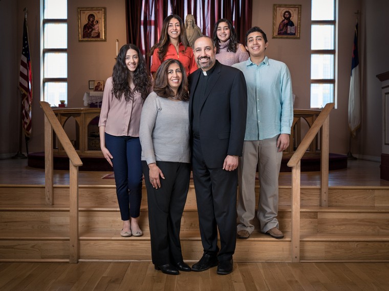 Rev. Khader El-Yateem with his wife and family in front of the sanctuary of the Salam Arabic Lutheran Church in Bay Ridge, Brooklyn.