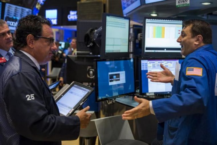 Traders work on the floor of the New York Stock Exchange shortly after the opening of the markets in New York