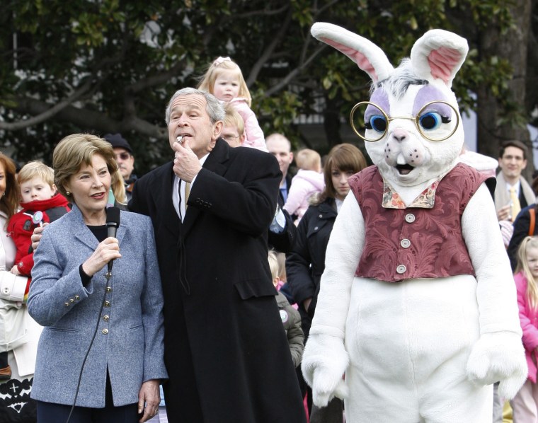 Image: U.S. President Bush blows a whistle to start the annual Easter Egg Roll in Washington