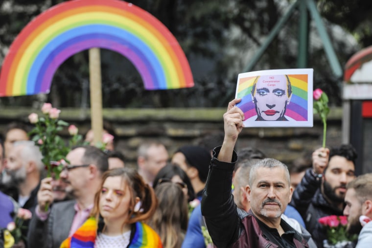 Image: Hundreds of activists gather outside the Russian Embassy in central London