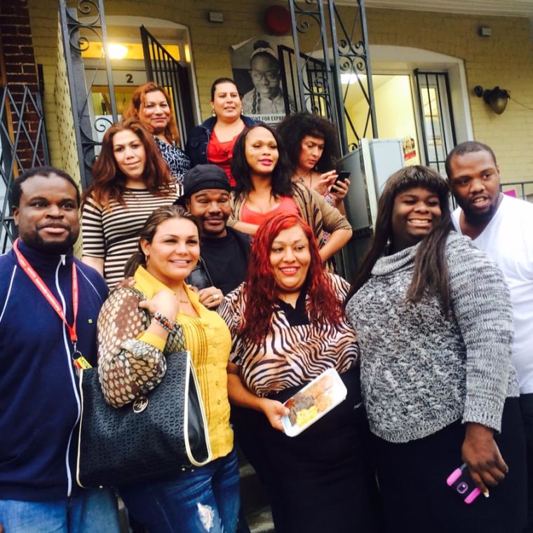 Ruby Corado (center) with Casa Ruby residents and volunteers