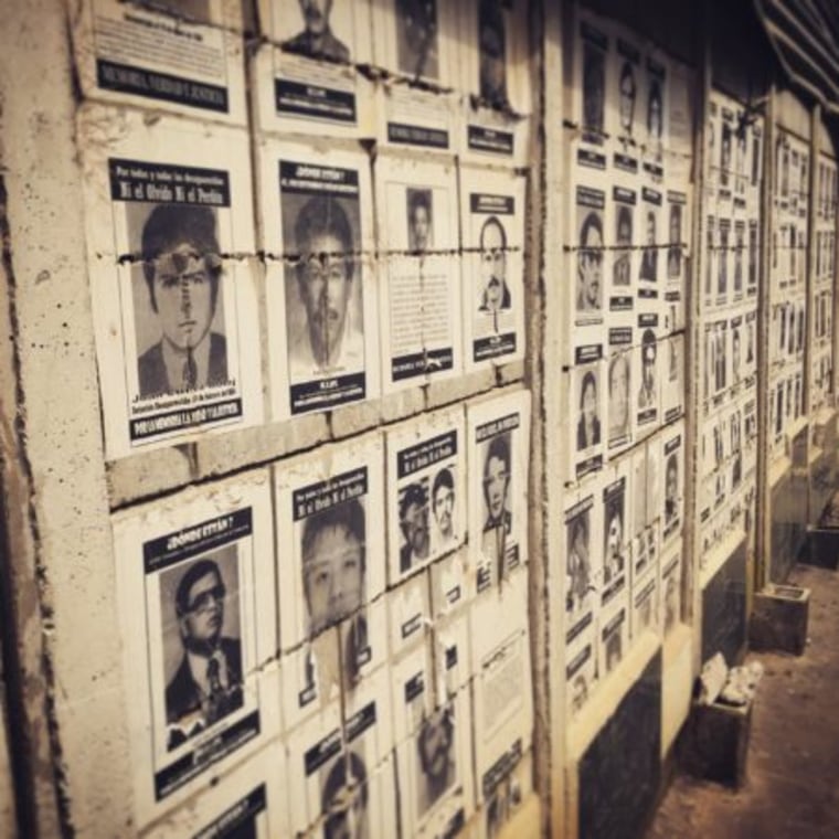 A wall of photos of the disappeared at La Verbena Cemetery in Guatemala City.