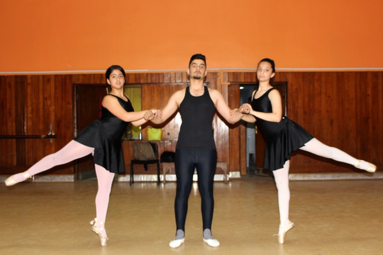 Image: Mass Taiseer, 14 (left) and Asawer Shamel,14 (right) learn ballet alongside male students