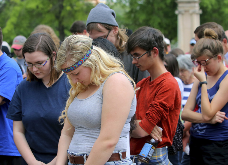 Protestors observe a moment of silence during a rally opposing Arkansas' upcoming executions, which are set to begin next week, on the front steps of the Capitol in Little Rock, Ark. on Friday, April 14, 2017.