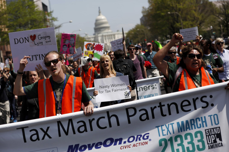 Image: Tax Day demonstrators march away from the U.S. Capitol on April 15, 2017 in Washington, DC. Activists gathered in cities nationwide to demand President Donald Trump release his tax returns.