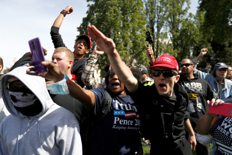 Image: Demonstrators in support of President Trump gesture during a rally in Berkeley.