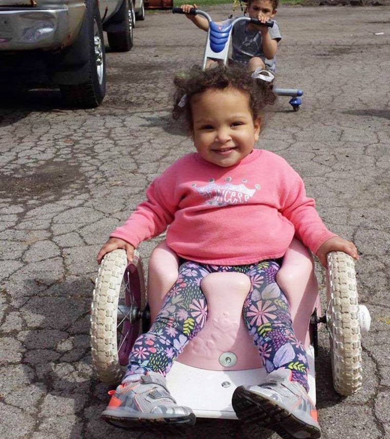 Thanks to a Bumbo-seat wheelchair, Bella Shorr can chase her brother and sister around outside.