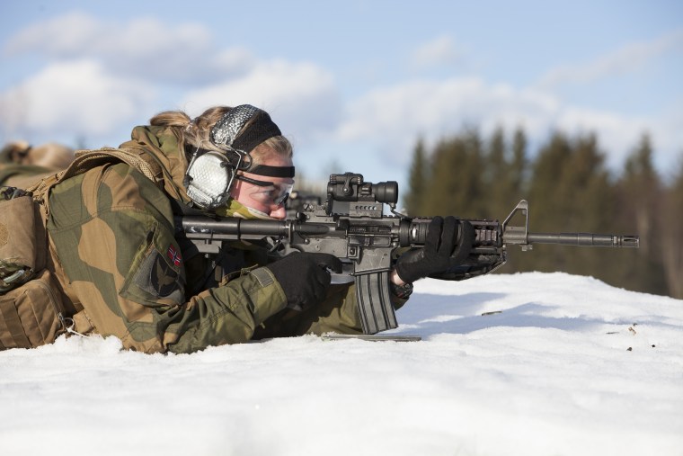 Image: A soldier fires her weapon during a military training exercise at the Terningmoen Camp