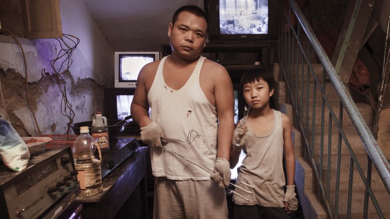 Zhao Jun as Big Wong and Wang Naixun as Little Wong in "King of Peking."