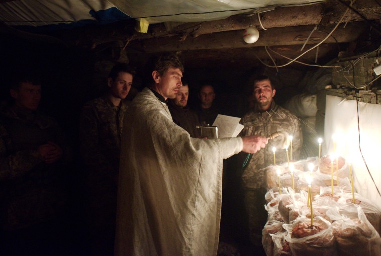 Image: Priest blesses Easter cakes to mark Orthodox Easter at position of Ukrainian troops