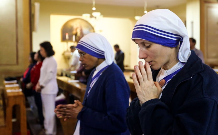 Image: Nuns of the Missionaries of Charity attend Easter mass at the Roman Catholic Church of San Francesco in the Libyan capital Tripoli
