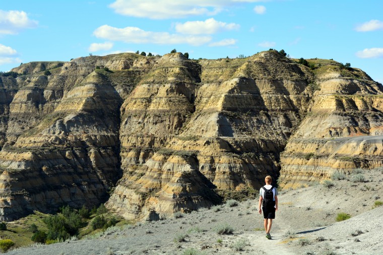 Mikah Meyer walking in his favorite national park so far, Theodore Roosevelt National Park in North Dakota.