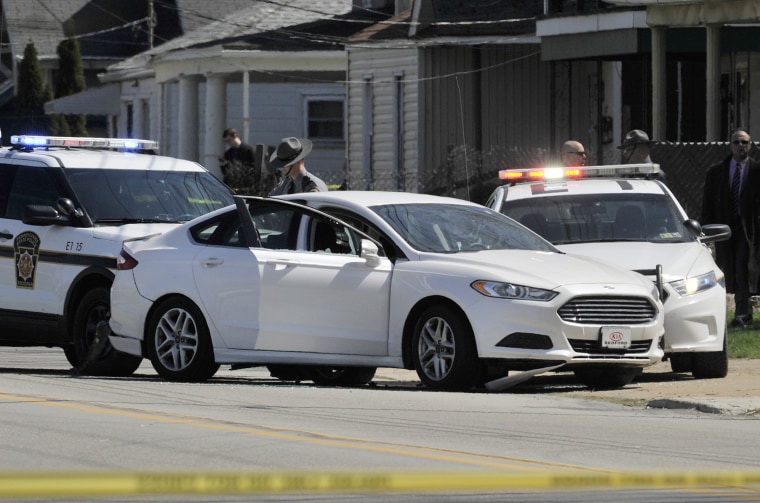 Image: Police investigate the scene where Steve Stephens was found shot dead