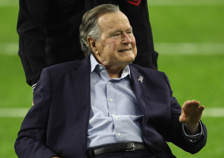 Image: President George H.W. Bush arrives for the coin toss prior to Super Bowl 51