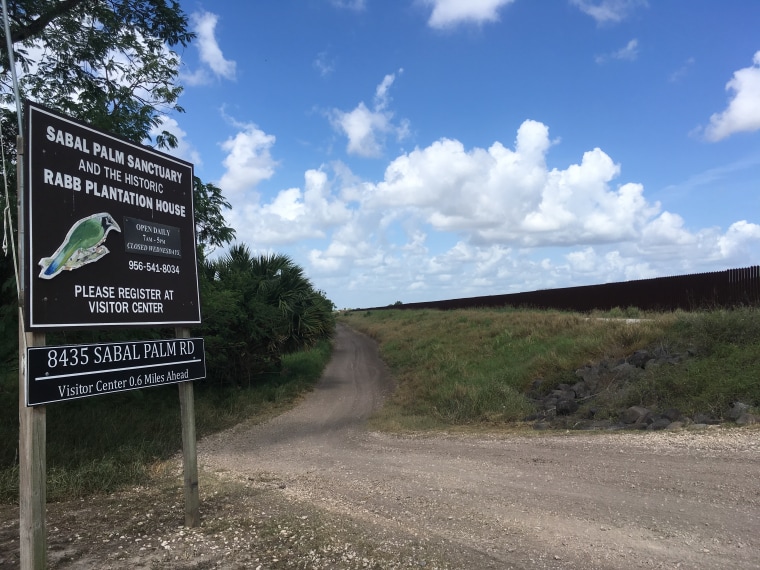 The border fence built by the George W. Bush administration stretches along land in Brownsville and in front of the sanctuary, that is behind the fence but still in the United States.