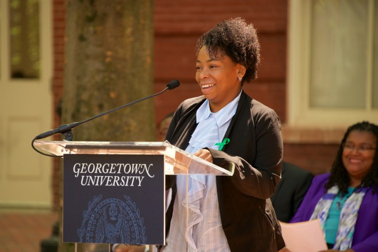 Ms. Jessica Tilson, descendant of the Hawkins, Hill, Scott, Butler, and Diggs family lines, delivers remarks at the dedication ceremony of Isaac Hawkins and Anne Marie Becraft Halls at Georgetown University.