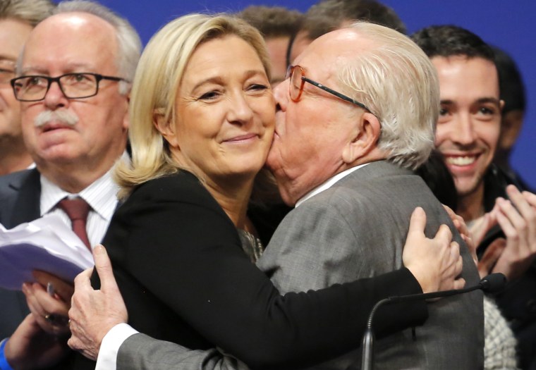 Image: French far-right Front National leader Marine Le Pen is kissed by her father Jean-Marie Le Pen