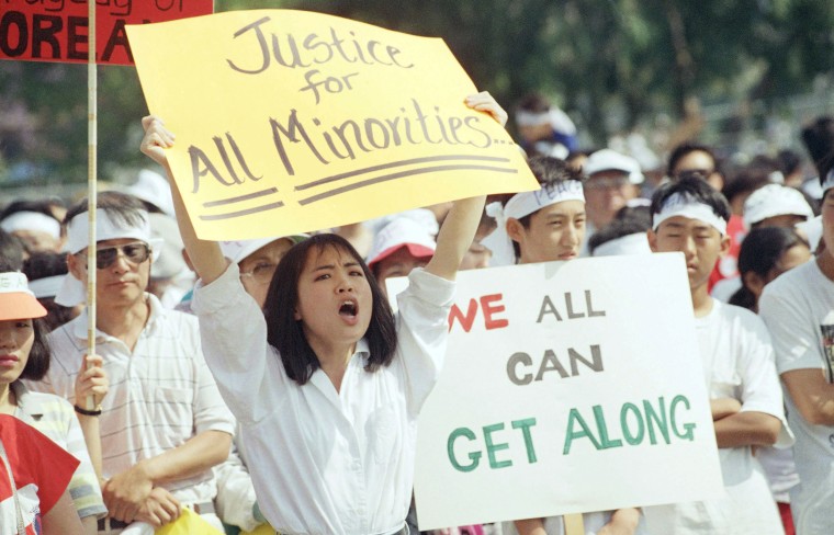 Image: A crowd rallies in Koreatown's Admiral Park in Los Angeles to call for healing between Koreans and the African-American community