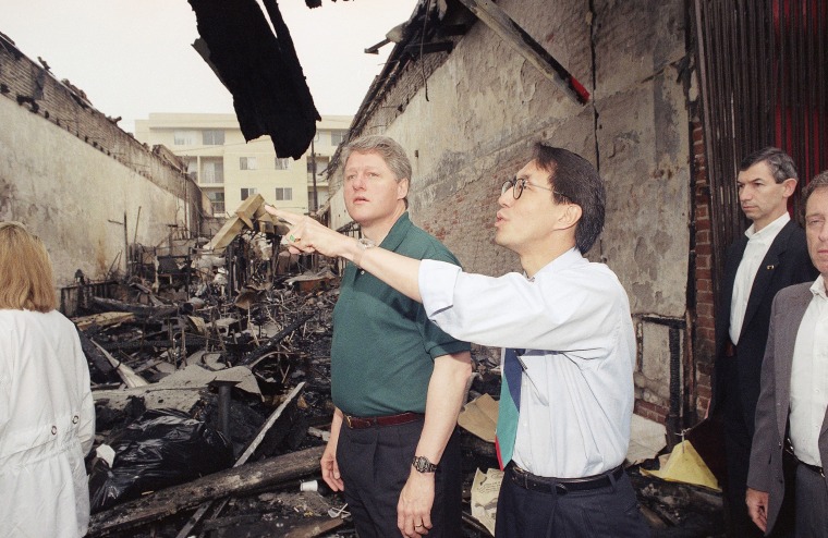 Image: Los Angeles councilman Mike Wu shows presidential candidate Bill Clinton the damage in Koreatown