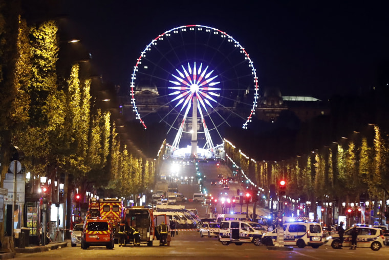 Image: Police block the Champs Elysees after a shooting attack in Paris