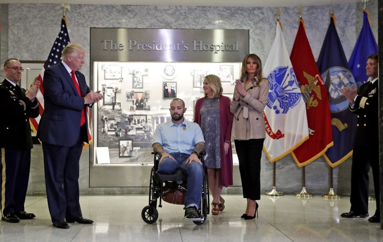 Image: President Donald Trump applauds after awarding a Purple Heart to U.S. Army Sgt. 1st Class Alvaro Barrientos.