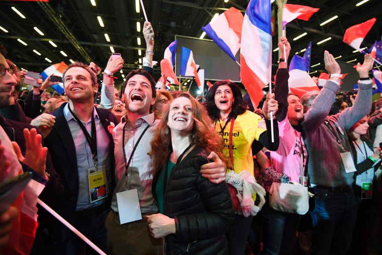 Image: Supporters of French presidential election candidate Centrist Emmanuel Macron celebrate after the results of the first round of the presidential elections