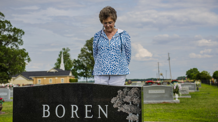 Dumas, AR - Genie Boren stands at the grave of her husband, Cecil Boren, who was murdered in 1999.