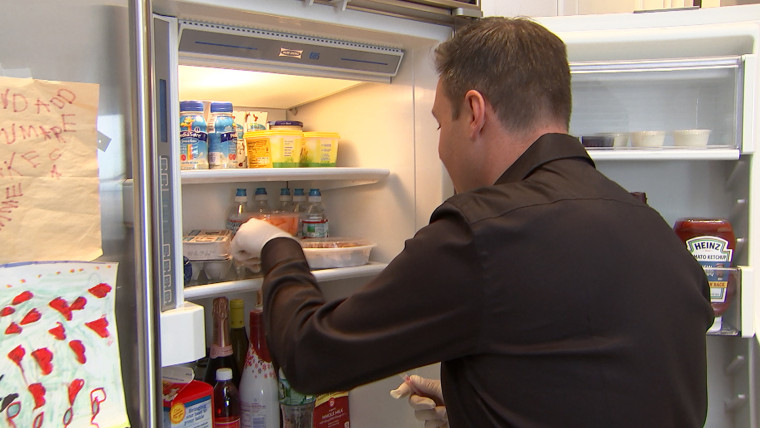 Jeff Rossen swabs his refrigerator shelf.