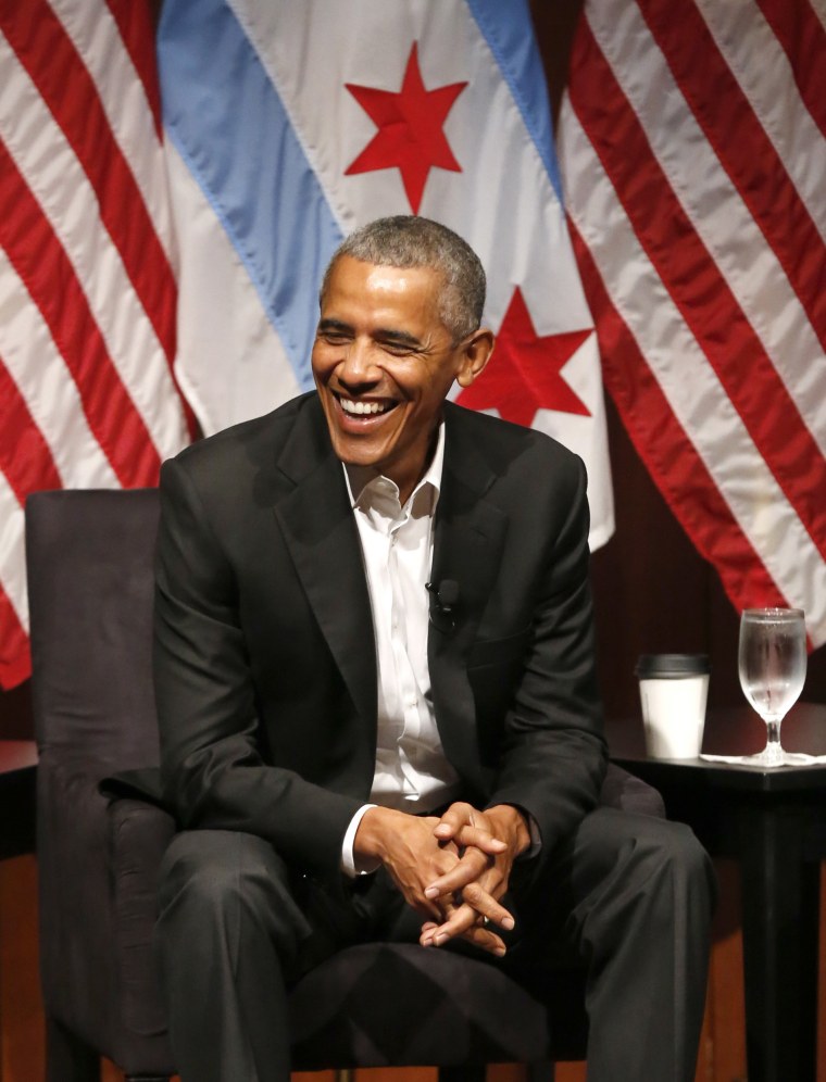 Image: Former President Barack Obama smiles as he hosts a conversation on civic engagement and community organizing