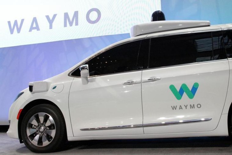 Waymo unveils a self-driving Chrysler Pacifica minivan during the North American International Auto Show in Detroit