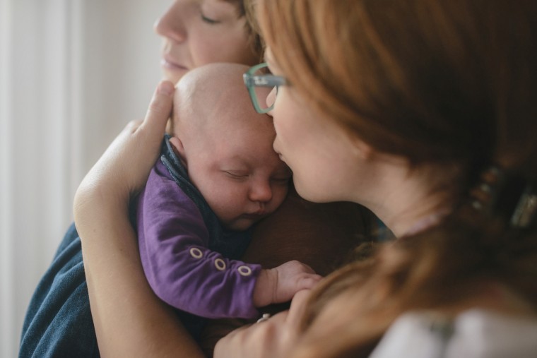 Lesbian couple with newborn child.