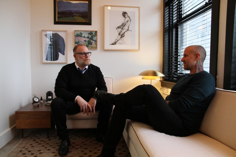 Jason Arsenault (right) in his office with a coworker