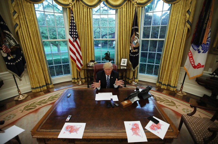 Image: President Donald Trump speaks during an interview with Reuters in the Oval Office of the White House in Washington