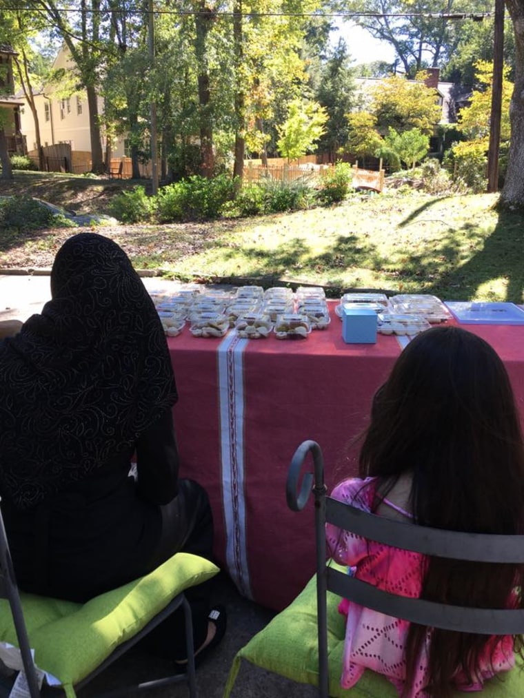 Ruwaida and her daughter sell Syrian cookies, homemade from a family recipe.