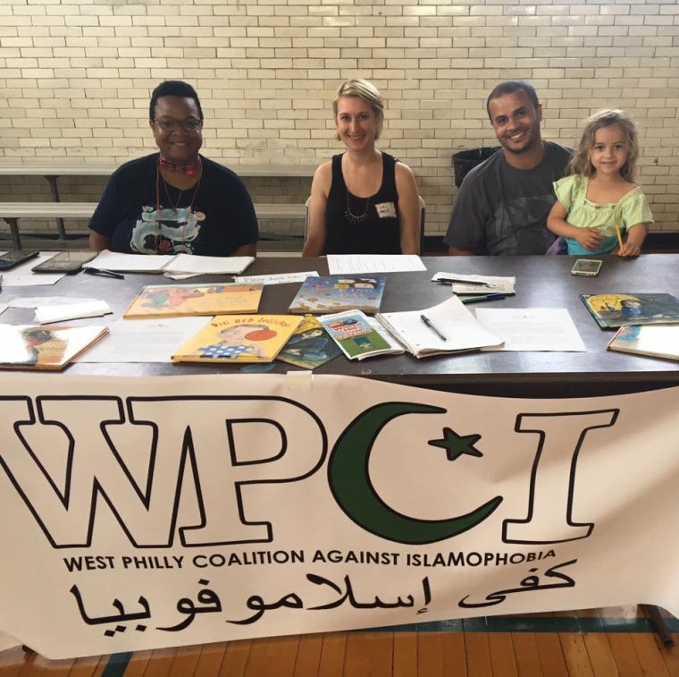 Board members of WPCI at a community event promoting the books project. From left: Deej Johnson, Elizabeth Deegan, Aziz Akabouche (Melanie Bartlett's husband) and Aziz's and Melanie's daughter Basma