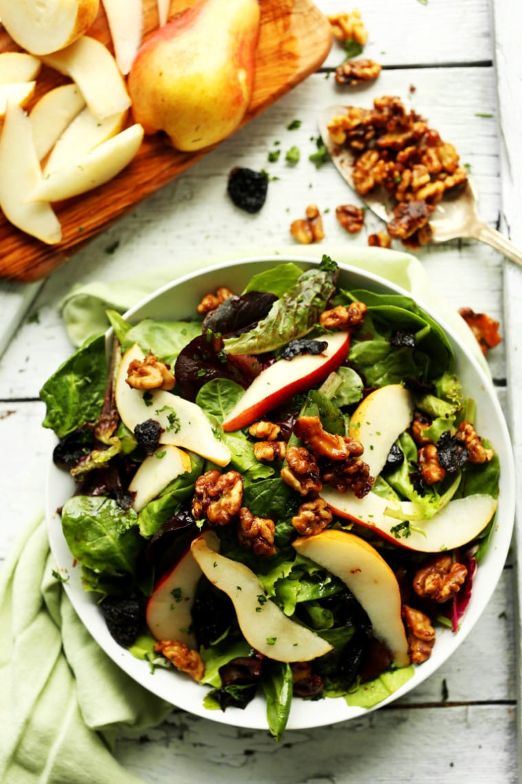 https://media-cldnry.s-nbcnews.com/image/upload/t_fit-760w,f_auto,q_auto:best/newscms/2017_18/1984736/170501-easy-salad-with-pears-dried-cherries-and-candied-walnuts-vegan-glutenfree-salad-recipe-healthy-summer-ac-555p-1984736.jpg