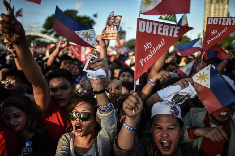 Image: Supporters of presidential candidate and Davao Mayor Rodrigo Duterte cheer during an election campaign rally ahead of the presidential and vice presidential elections in Manila on May 7, 2016.